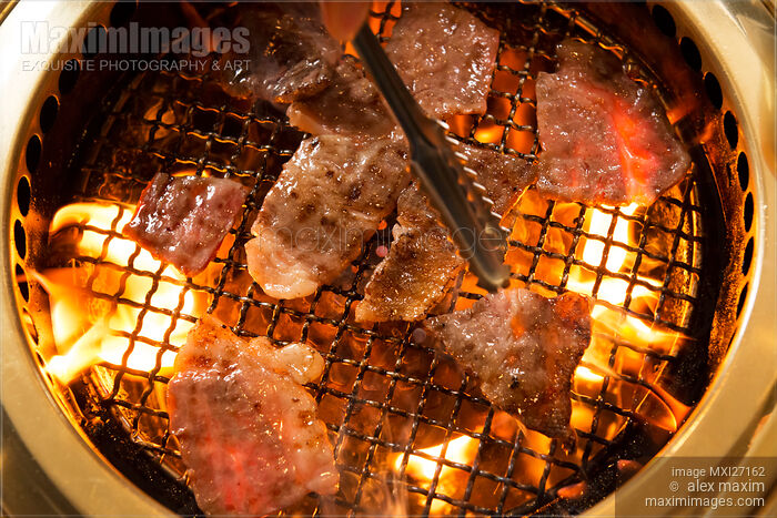 Stock photo of Closeup of Japanese beef being grilled on fire Buy commercial use license at MaximImages