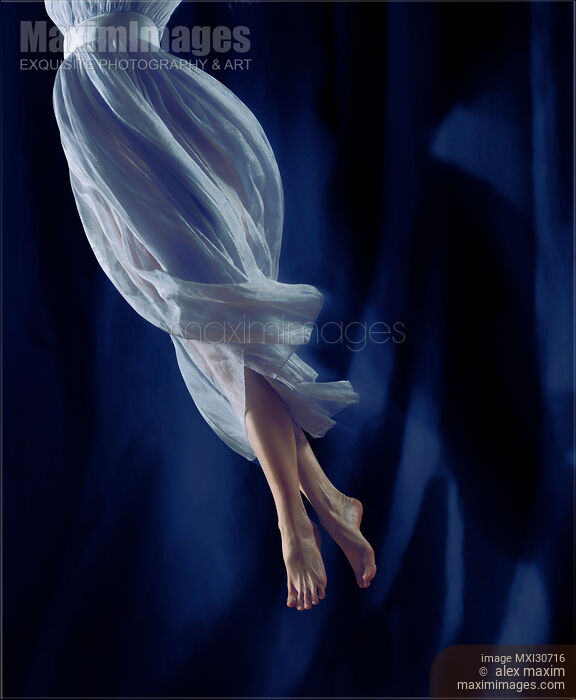 Closeup of legs of a woman dancer spinning in the air Stock photo of Closeup of legs of a woman dancer spinning in the air Buy commercial use license at MaximImages
