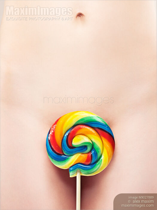 Stock photo of Closeup of Naked Woman Body with a Colorful Lollipop Buy commercial use license at MaximImages