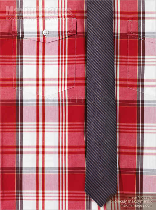 Stock photo of Closeup of red tartan shirt with a skinny necktie Buy commercial use license at MaximImages