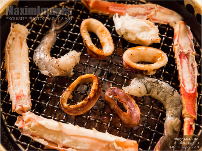 Stock photo of Closeup of seafood on grill stove Buy commercial use license at MaximImages