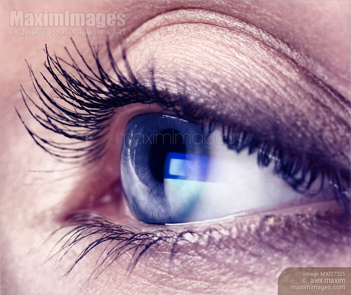 Stock photo of Closeup of woman eye with blue screen reflecting in it Buy commercial use license at MaximImages