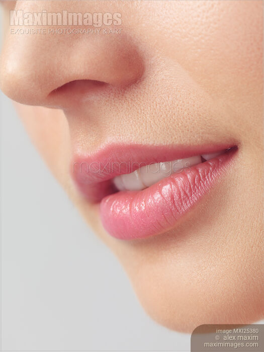 Stock photo of Closeup of woman mouth with pink lips Buy commercial use license at MaximImages