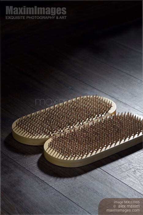 Stock photo of Closeup of Yogic Sadhu Board of sharp metal nails Buy commercial use license at MaximImages