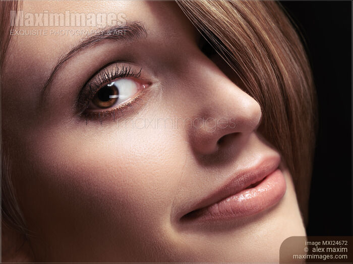 Stock photo of Closeup of young beautiful woman face Buy commercial use license at MaximImages
