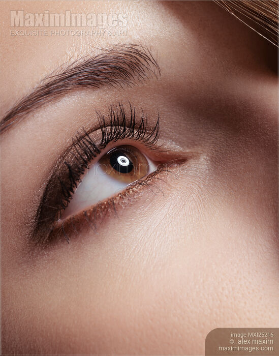 Stock photo of Closeup of young woman eye Buy commercial use license at MaximImages