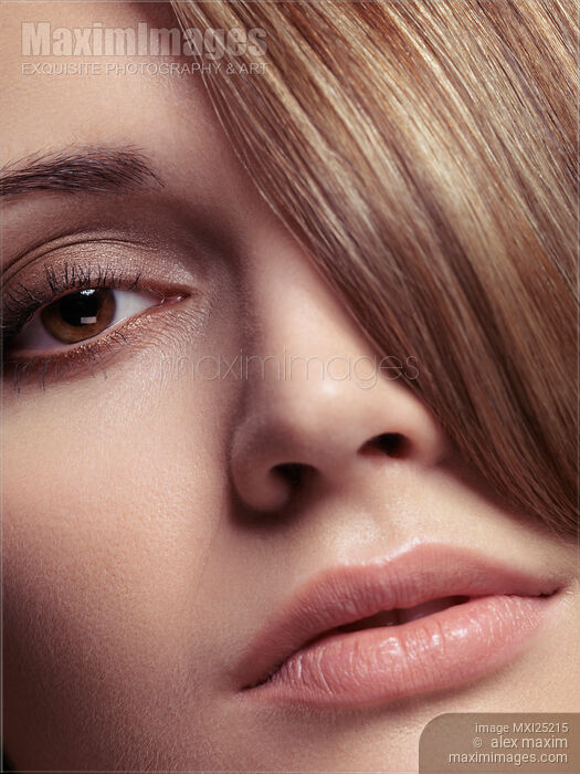 Closeup of young woman face Stock photo of Closeup of young woman face Buy commercial use license at MaximImages