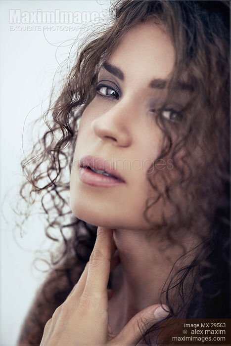 Closeup portrait of a young woman with deep expressive sensual look Stock photo of Closeup portrait of a young woman with deep expressive sensual look Buy commercial use license at MaximImages