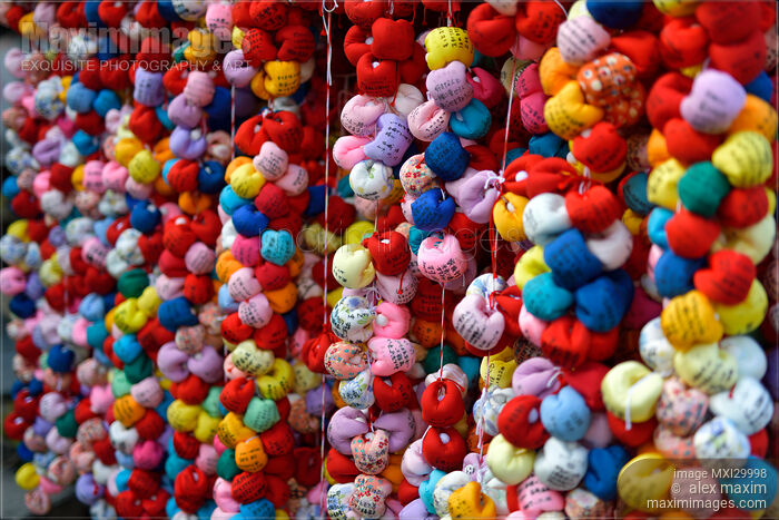 Stock photo of Colorful cloth balls Kukurizaru with written wishes hanging at Yasaka Koshin-do temple in Kyoto Buy commercial use license at MaximImages