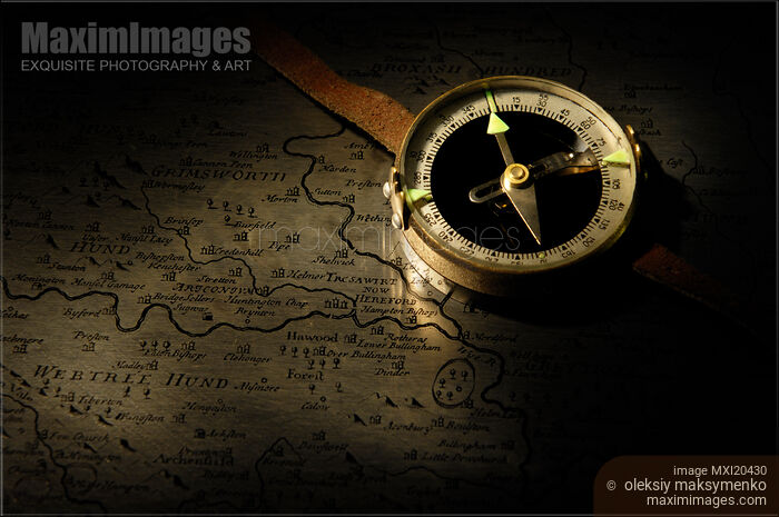 Compass on an Old Map Stock photo of Compass on an Old Map Buy commercial use license at MaximImages