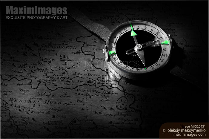 Stock photo of Compass on an Old Map Buy commercial use license at MaximImages