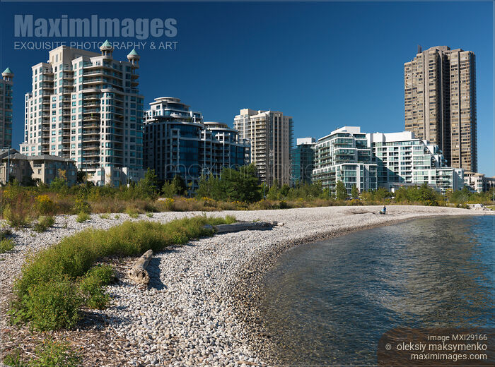 Stock photo of Condos on a Lake Shore Buy commercial use license at MaximImages