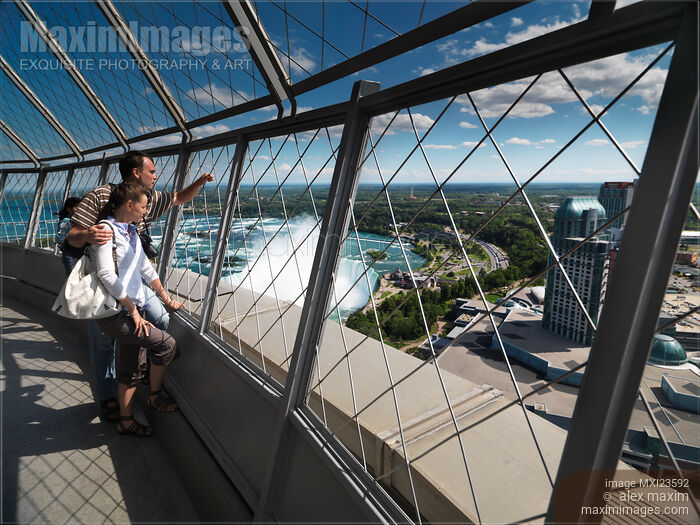 Couple Enjoying View of Niagara Falls Stock photo of Couple Enjoying View of Niagara Falls Buy commercial use license at MaximImages