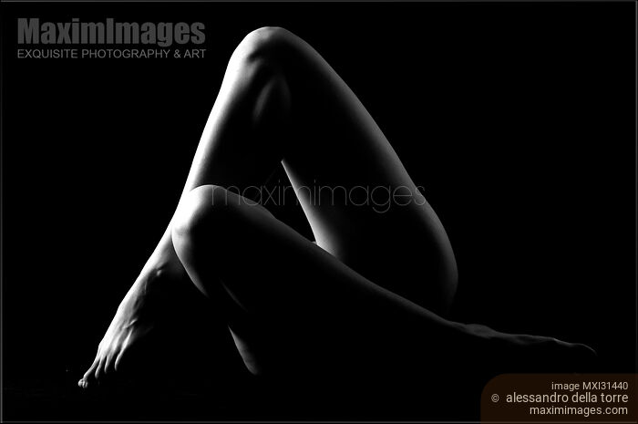 Crossed woman legs abstract black and white artistic nude Stock photo of Crossed woman legs abstract black and white artistic nude Buy commercial use license at MaximImages