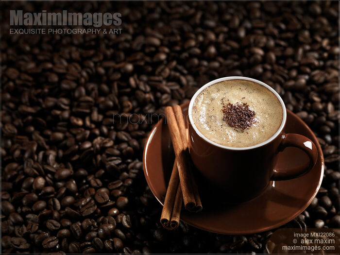 Cup of Coffe Latte on Coffee Beans Stock photo of Cup of Coffe Latte on Coffee Beans Buy commercial use license at MaximImages