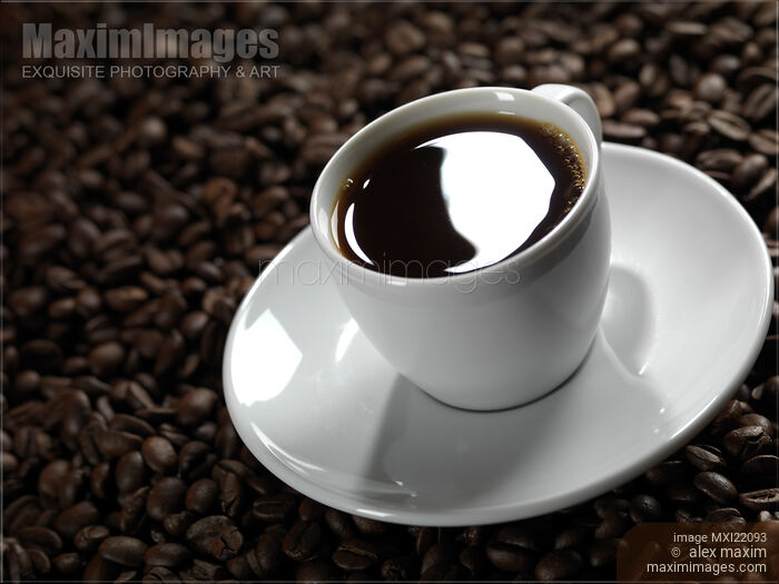 Cup of Coffe on Coffee Beans Stock photo of Cup of Coffe on Coffee Beans Buy commercial use license at MaximImages