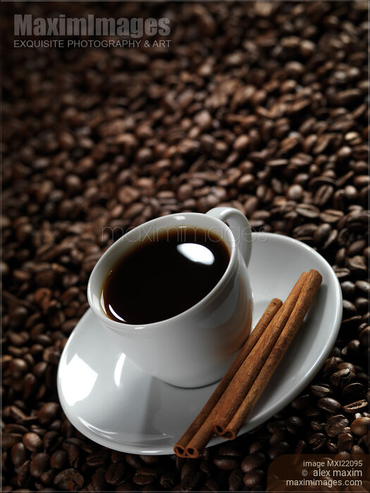 Cup of Coffe on Coffee Beans Stock photo of Cup of Coffe on Coffee Beans Buy commercial use license at MaximImages