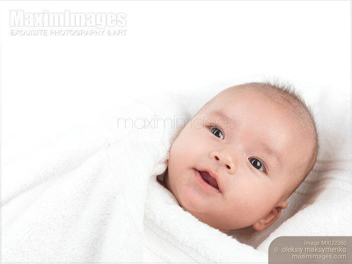 Stock photo of Cute Baby Boy Wrapped in a Towel Buy commercial use license at MaximImages