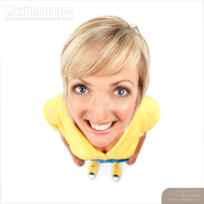 Stock photo of Cute smiling young woman humorous photo Buy commercial use license at MaximImages