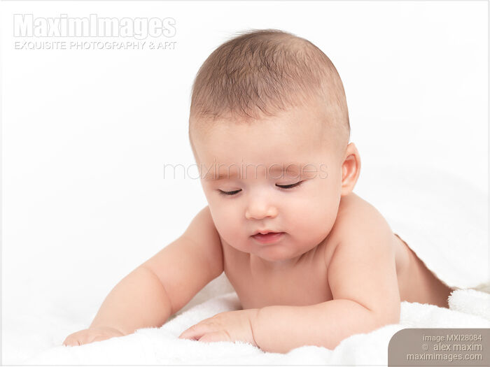 Stock photo of Cute thoughtful baby looking down Buy commercial use license at MaximImages