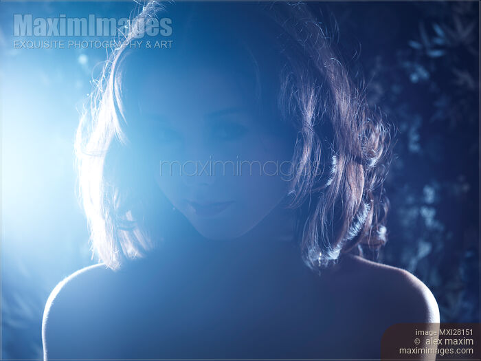 Dark dramatic portrait of a woman Stock photo of Dark dramatic portrait of a woman Buy commercial use license at MaximImages