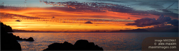 Dark glowing amber sunset sky panorama in Nanaimo Vancouver Island Stock photo of Dark glowing amber sunset sky panorama in Nanaimo Vancouver Island Buy commercial use license at MaximImages