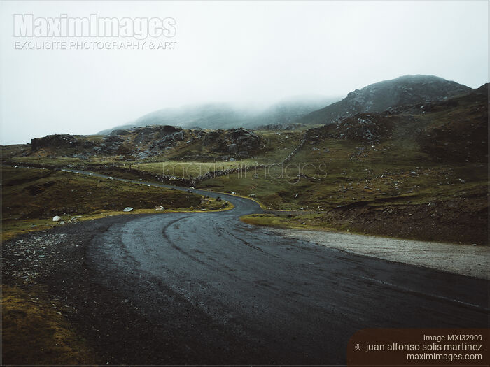 Stock photo of Dark moody winding road in Sligo Ireland dramatic misty landscape Buy commercial use license at MaximImages