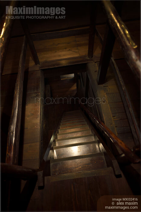 Stock photo of Descending dark wooden staircase in a floor opening of a house Cellar Dungeon Basement Buy commercial use license at MaximImages