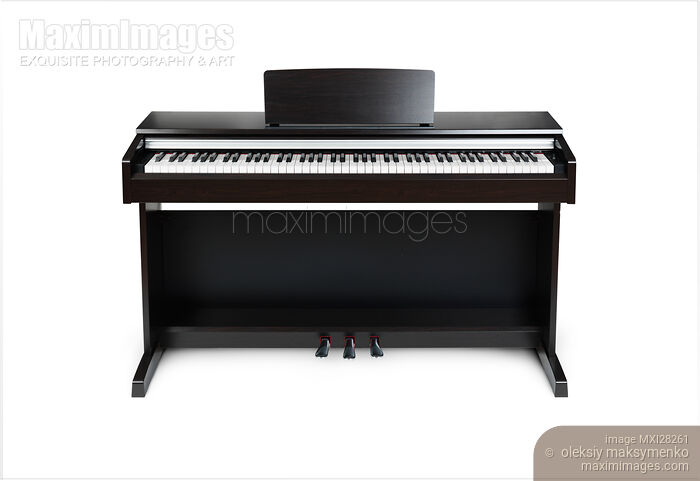 Stock photo of Digital piano isolated on white background Buy commercial use license at MaximImages