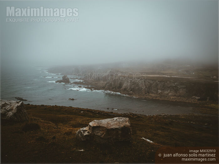 Dramatic aerial nature scenery of rocky sea shore in fog Sligo Ireland Stock photo of Dramatic aerial nature scenery of rocky sea shore in fog Sligo Ireland Buy commercial use license at MaximImages
