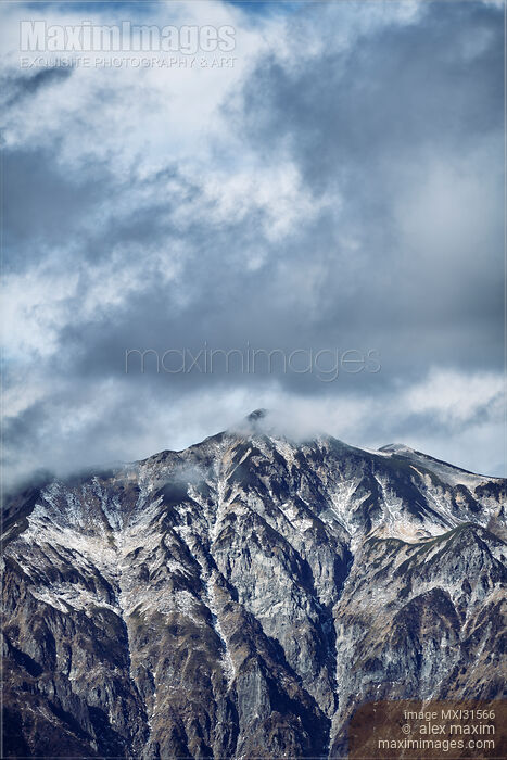 Dramatic atmospheric scenery of Mount Kasa peak Kasa-ga-take Japan Northern Alps Stock photo of Dramatic atmospheric scenery of Mount Kasa peak Kasa-ga-take Japan Northern Alps Buy commercial use license at MaximImages