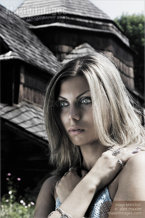 Stock photo of Dramatic expressive portrait of a young woman with ghostly gray eyes and a possessed or astonished look Buy commercial use license at MaximImages
