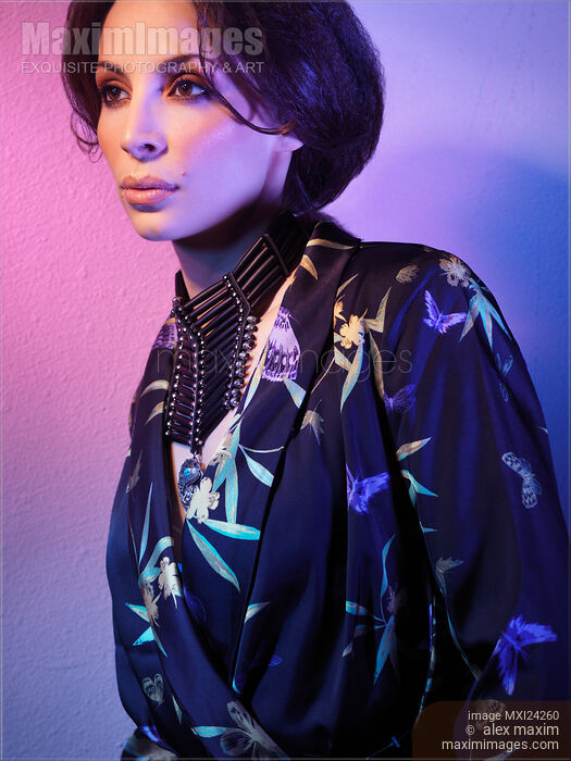 Stock photo of Dramatic portrait of a beautiful woman wearing fashionable clothing and accessories Buy commercial use license at MaximImages