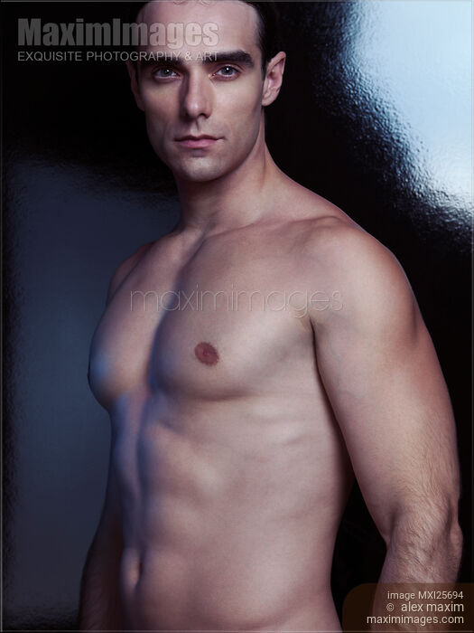 Stock photo of Dramatic portrait of a sexy young man with bare torso Buy commercial use license at MaximImages