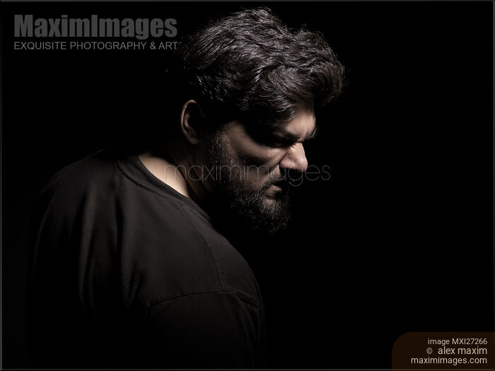 Stock photo of Dramatic portrait of angry middle aged man Buy commercial use license at MaximImages