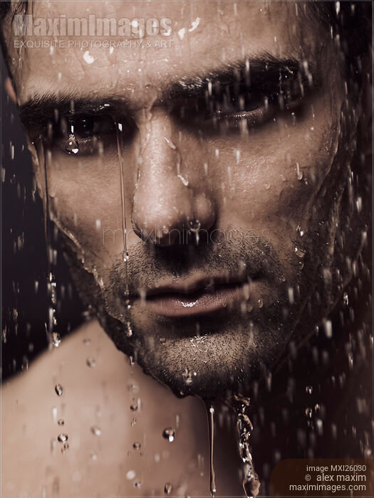 Dramatic portrait of man face with water pouring over it Stock photo of Dramatic portrait of man face with water pouring over it Buy commercial use license at MaximImages