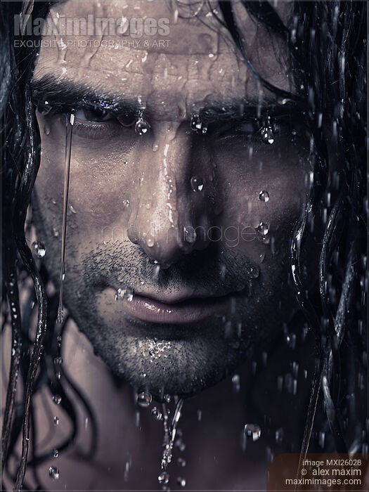 Stock photo of Dramatic portrait of man wet face with long hair Buy commercial use license at MaximImages