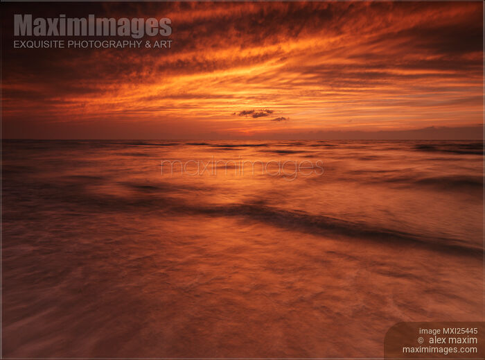 Stock photo of Dramatic red sky over lake Huron sunset scenery Buy commercial use license at MaximImages