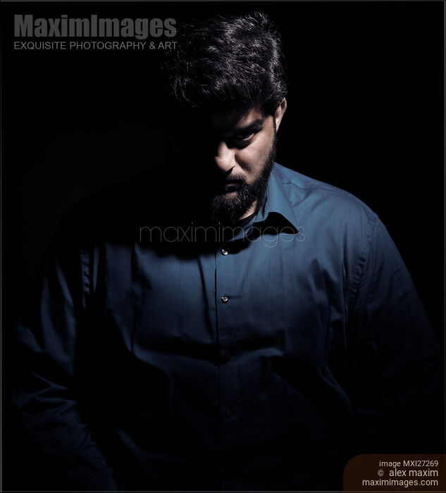 Dramatic shadowy portrait of a man Stock Image MXI27269 © Alex Maxim / MaximImages