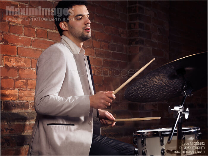 Stock photo of Drummer playing drums Buy commercial use license at MaximImages