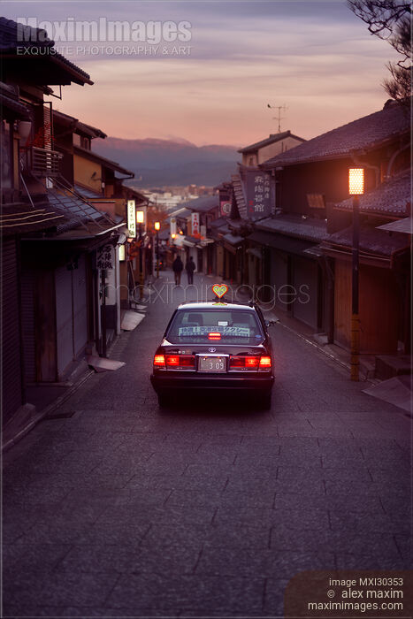 Stock photo of Early morning taxi cab on Matsubara dori empty street in Kyoto before sunrise Buy commercial use license at MaximImages
