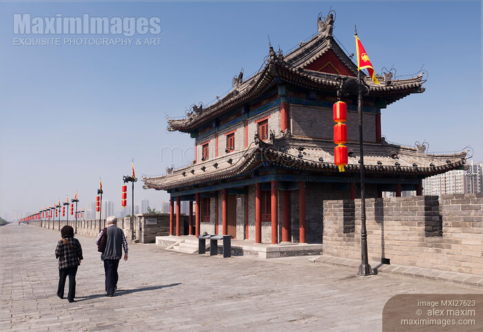Stock photo of Elderly couple on Xi'an city wall in China Buy commercial use license at MaximImages