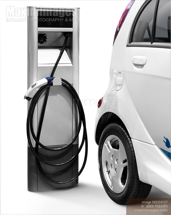 Stock photo of Electric car at a charging station Buy commercial use license at MaximImages
