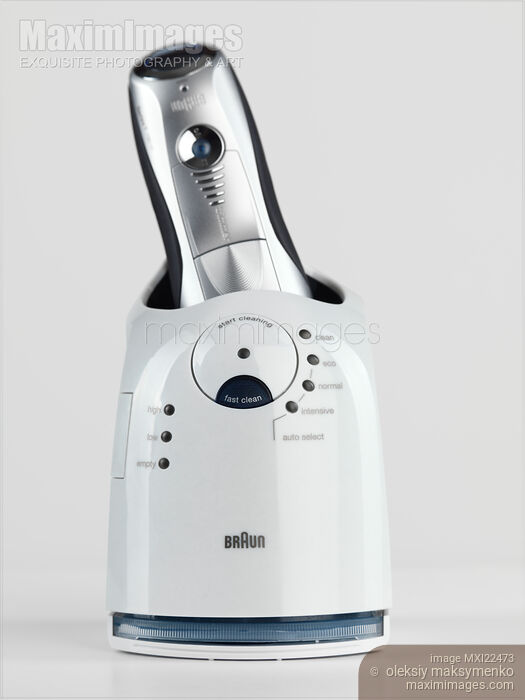 Electric Shaver with Self Cleaning System Stock photo of Electric Shaver with Self Cleaning System Buy commercial use license at MaximImages