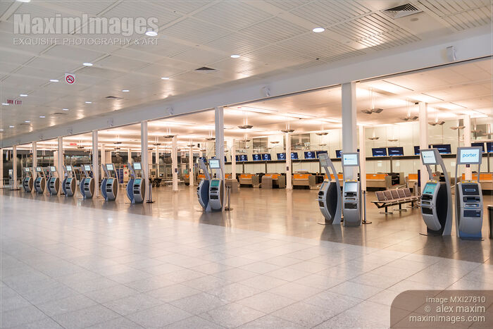 Stock photo of Electronic check-in kiosks at an airport Buy commercial use license at MaximImages