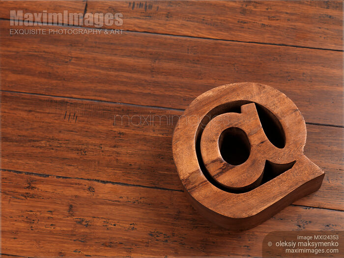 Email symbol at made on hardwood floor Stock photo of Email symbol at made on hardwood floor Buy commercial use license at MaximImages