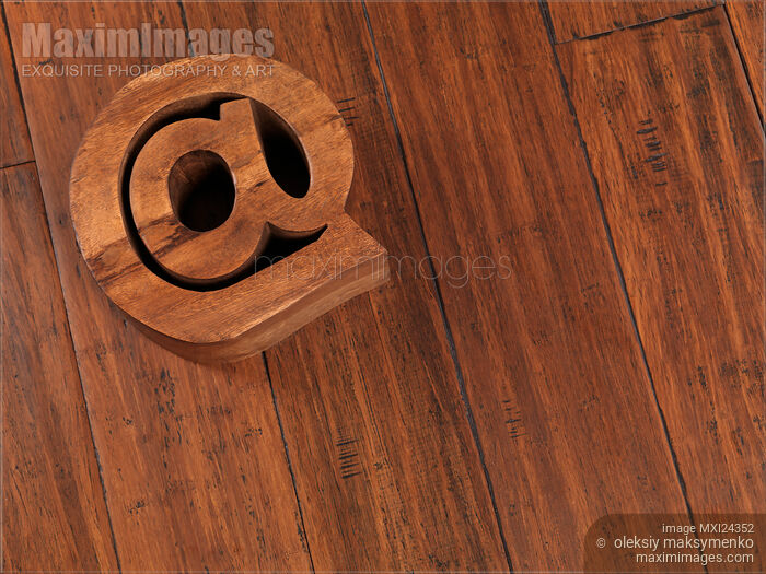 Email symbol at made on wooden floor Stock photo of Email symbol at made on wooden floor Buy commercial use license at MaximImages