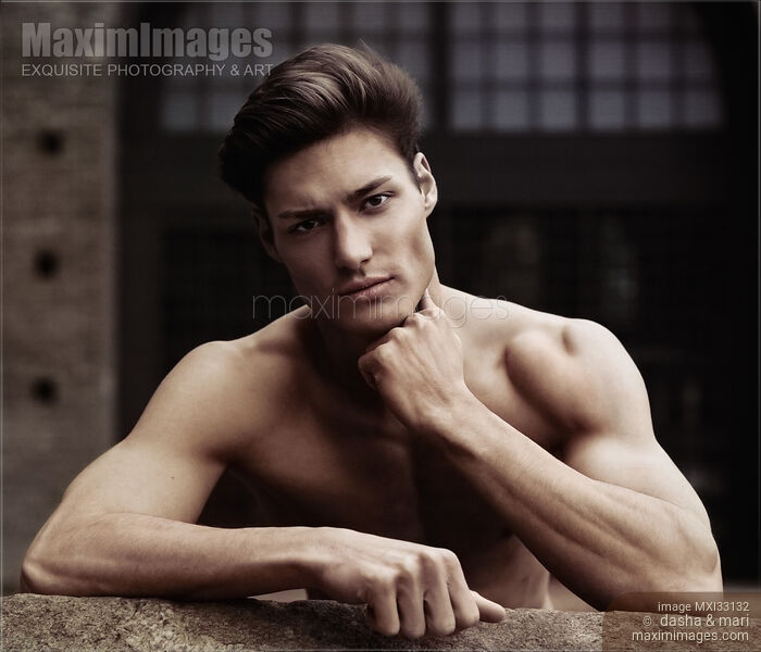 Stock photo of Expressive portrait of a sexy handsome muscular man with a bare torso and stylish short hair Buy commercial use license at MaximImages