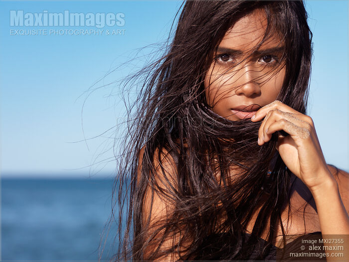 Expressive portrait of young exotic woman with long wet brown hair Stock photo of Expressive portrait of young exotic woman with long wet brown hair Buy commercial use license at MaximImages