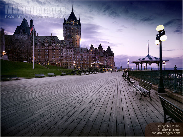 Fairmont Le Chateau Frontenac grand hotel Dufferin terrace in Quebec city with dramatic skies at night Stock photo of Fairmont Le Chateau Frontenac grand hotel Dufferin terrace in Quebec city with dramatic skies at night Buy commercial use license at MaximImages